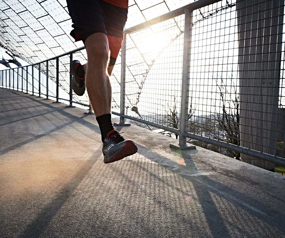 Runner with shoes using invisible fit technology