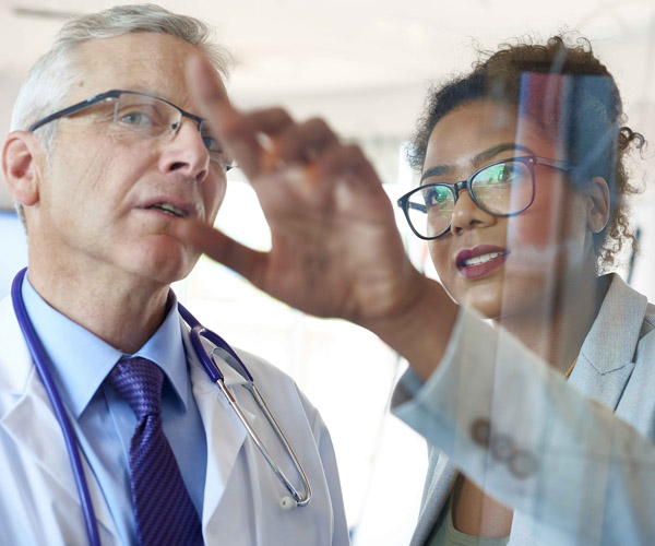 Doctors looking at a screen